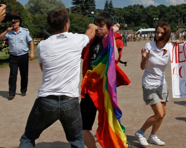 An anti-gay protester clashes with a gay rights activist during a Gay Pride event in St. Petersbur